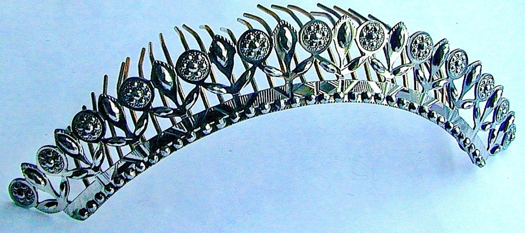 Fantastic early cut steel tiara that will crown your evenings with delight. The faceted steel will catch the light and create a halo about you. Cut steel became popular in the 18th century as a substitute for diamonds, the pieces carefully faceted