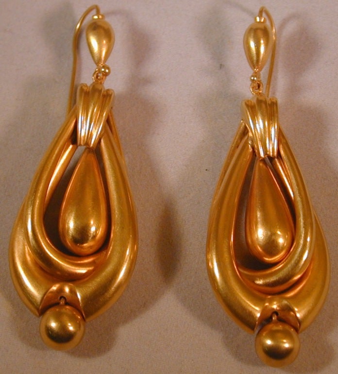 Dramatic 15K gold hoop and drop earrings are bold and beautiful but light and comfortable as well.