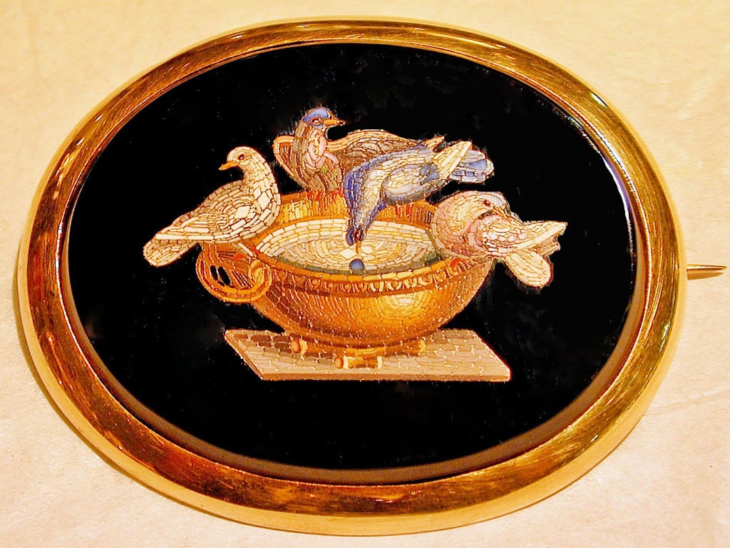 Classical micro mosaic brooch of the Doves of Pliny, set in a simple 18K gold bezel to emphasize the very fine example of craftsmanship displayed here. The orginal mosaic from Hadrian's Villa was discovered in 1737 and had been described by Pliny as