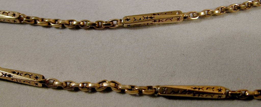 Victorian 9K yellow gold watch chain with a swivel attachment to hang a watch or magnifier or fob or pendant or locket. the chain measures 61