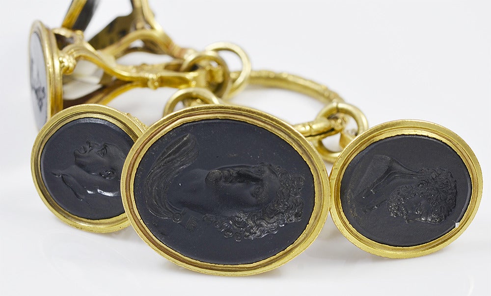Georgian Wedgwood group of watch fobs with black basalt intaglio seals set in gilt metal and attached to a 9K gold split ring.  One fob is marked Wedgwood and Bentley, the others are marked Wedgwood and are numbered. A wonderful collection of early