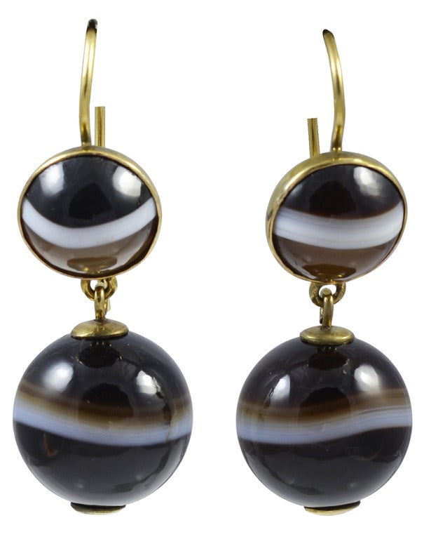 Bold banded agate drop earrings are great with both black and brown. Easy to wear during the day and dramatic at night time. They measure about 1 1/2