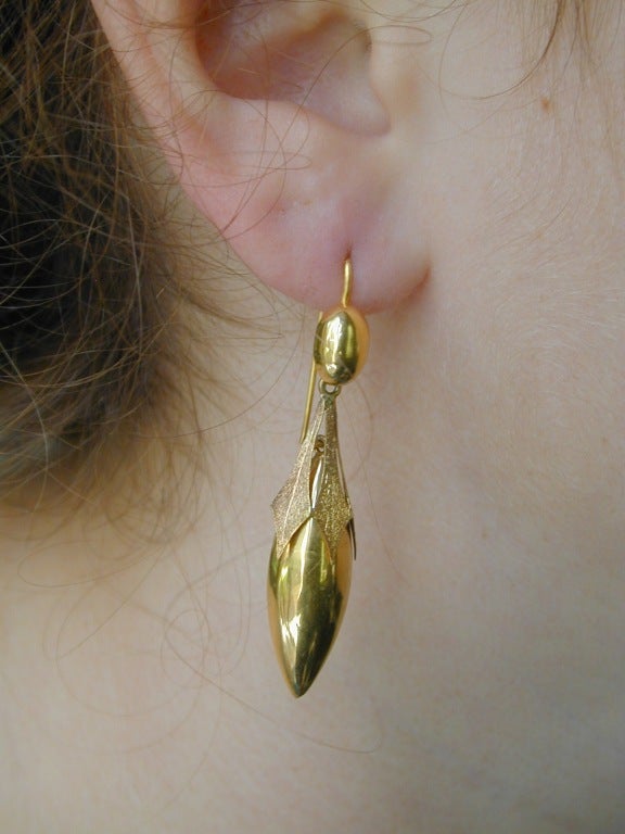 Early Victorian 15K gold drop earrings in a torpedo shape will hang gracefully over a suit or gown, day or night. They measure almost 2