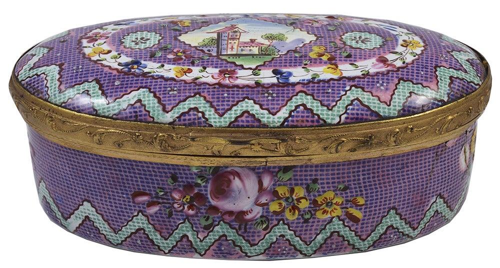 Lovely enamel snuff box made in Bilston c.1770-80. The box is decorated with a village scene surrounded with flowers on a geometric background. The box is made of enamel painted copper and measures 3 1/4