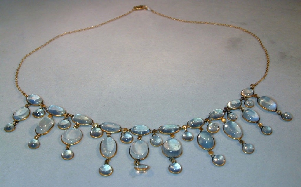 Sparklingly by sunlight or moonlight the moonstones in this drop necklace will delight all.  Ten rows of long moonstone drops interspersed by nine round stones make an impressive collar.