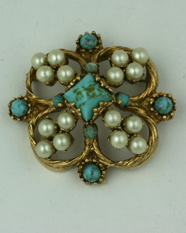 Chanel renaissance style brooch, quatrefoil in form of turquoise pate de verre and multiple pearls.This style of brooch was one of Chanel's 