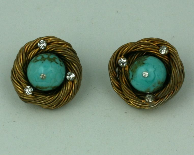 Classic Chanel earclips of faux turquoise pate de verre rounded cabochons set in signature handmade birds nest wire setting with pastes by studio Goossens. The style of these particular earclips are a staple in the Chanel oevre of her post war