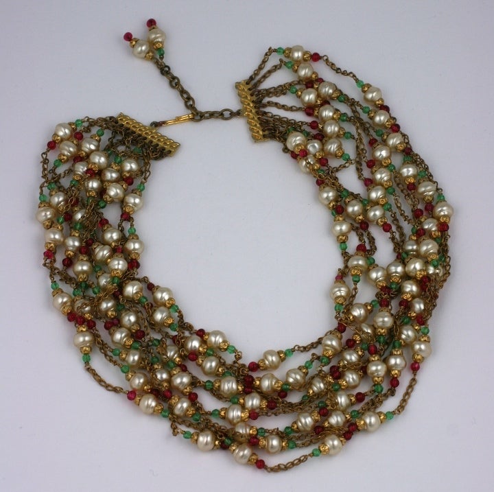 Chanel multi chain pearl, emerald and ruby handmade glass collar. Designed by Gripoix mid 1950s to look as though each strand is casually wrapped around the neck, a part of the Chanel idiom of an instictive effortless elegance. Unsigned

16-19