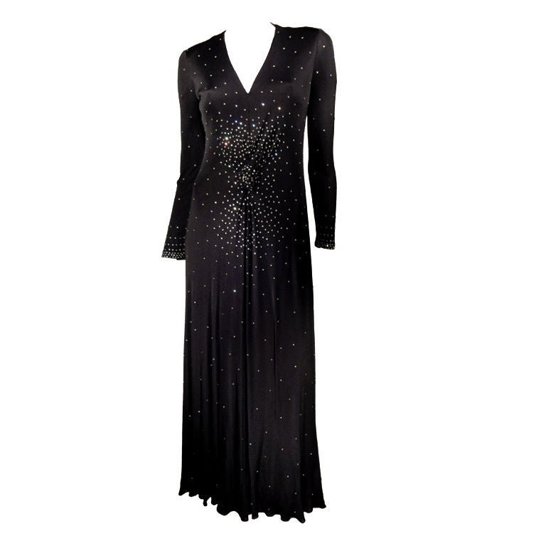 John Anthony black, long sleeve, jersey dress encrusted with prong set diamante and back zipper.