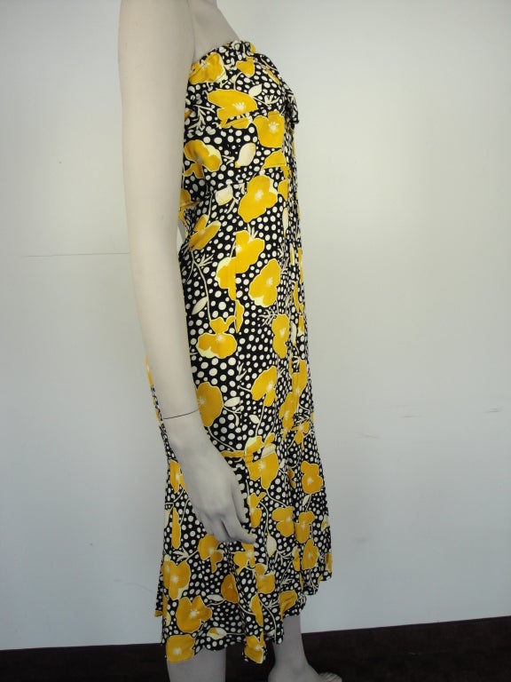Tuleh poppy print strapless dress with side glass buttons and fully lined.