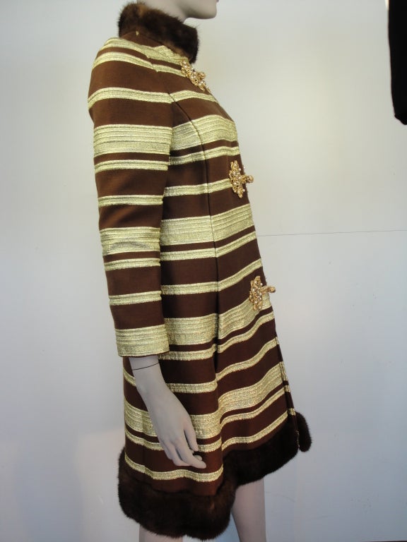 Oscar De la Renta 1960's coat, chocolate brown and gold metallic stripe,mink trim,two front pockets,zipper front and fully lined.<br />
<br />
shoulder to shoulder 25 inch<br />
bust 36 inch<br />
hips 40 inch<br />
length 41 inch