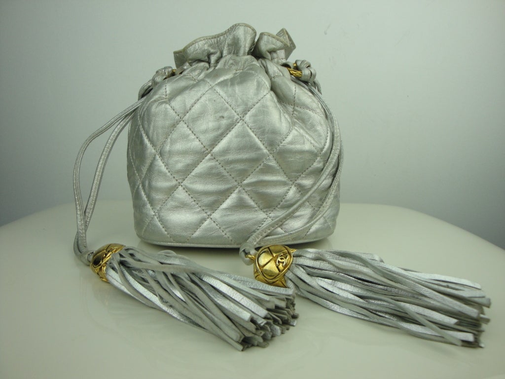 Chanel silver leather quilted bag with tassel pulls,original dust bag and authenticity card.