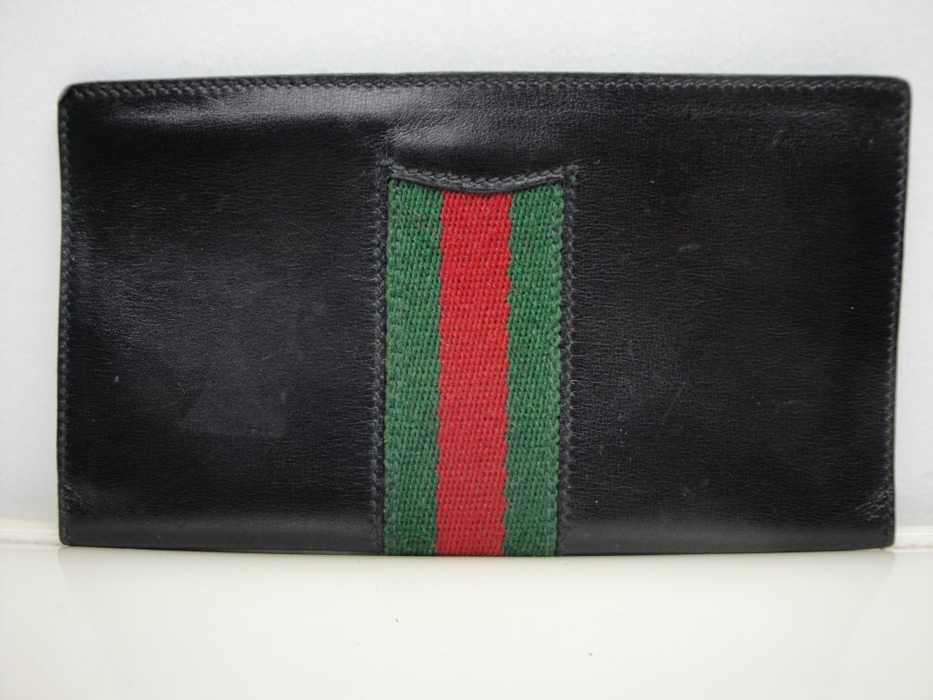 Gucci black leather checkbook with red/green/red web.