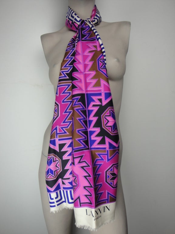 Lanvin geometric silk scarf with gorgeous color palette of pink,purple,cream,brown and black. The scarf has fringe on both ends and is labeled Lanvin. Circa:1980's