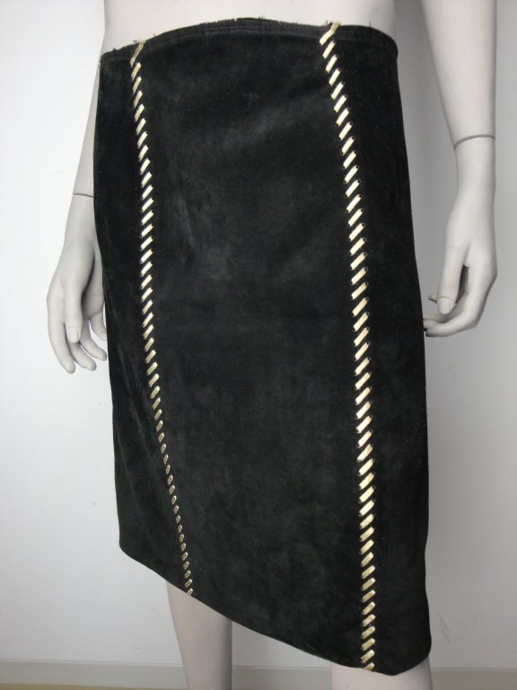 Yves Saint Laurent black suede pencil skirt,gold braided front and back and fully lined.

Label Yves Saint Laurent circa 1980