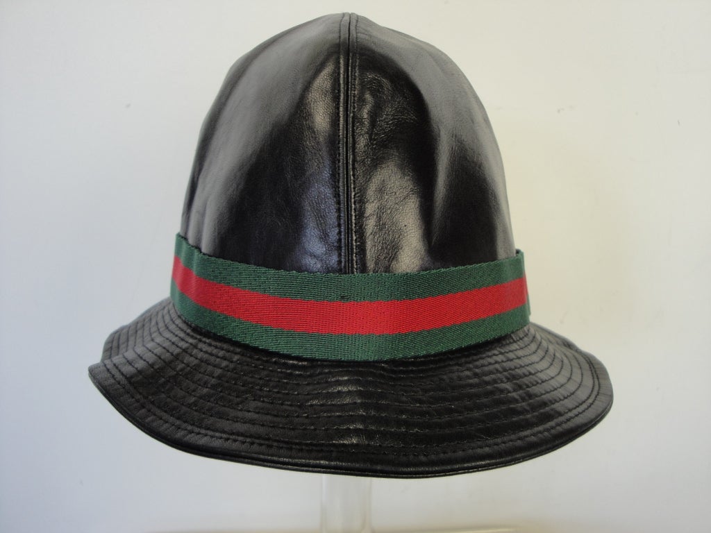 Gucci black leather hat with the green red green web.