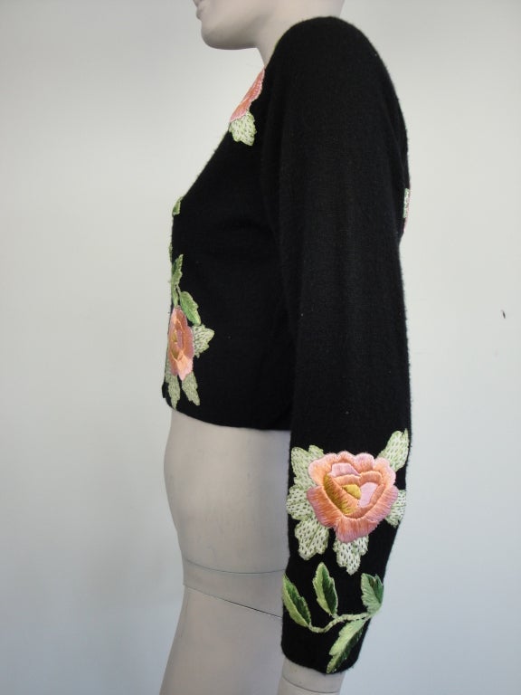 Helen Bond Carruthers black cardigan with embroidered roses,green glass buttons,fully lined and has signature band label. Circa 1950's