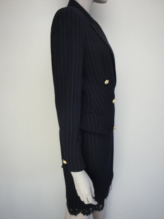 Donna Karan navy blue pinstriped double breasted dress with lace trim,two front pockets and fully lined.
