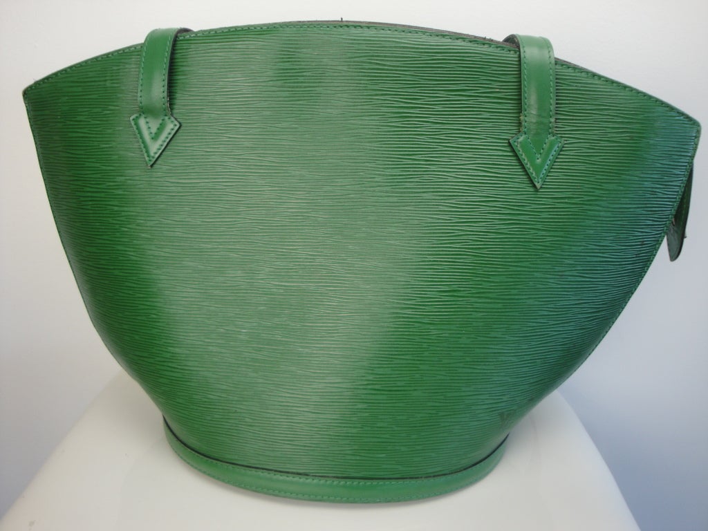 Louis Vuitton guaranteed authentic menthe epi leather shoulder bag with two interior pockets.