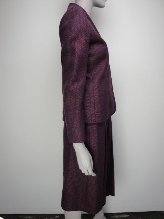 Givenchy 5 skirt suit. The button front jacket is fully lined. The pleated skirt has side zip and fully lined.