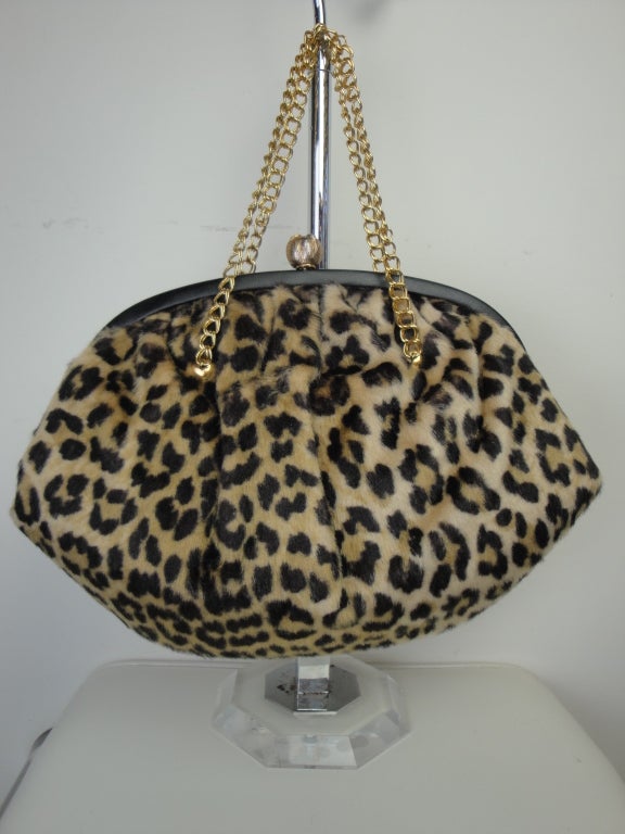 La France faux leopard handbag with zippered interior pocket.