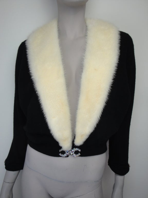 Two interchangeable Bernhard Altmann cashmere cardigans with mink trim. One black and one cream cashmere with interchangeable cream mink collar.