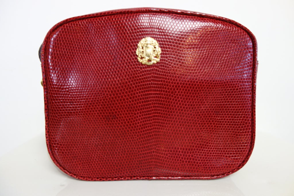 Celine 1980's cross body red lizard handbag with one interior zip pocket lined in moire'.