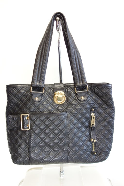 Marc Jacobs black quilted handbag,one zip front pocket,one buckled pocket and large interior zip pocket.