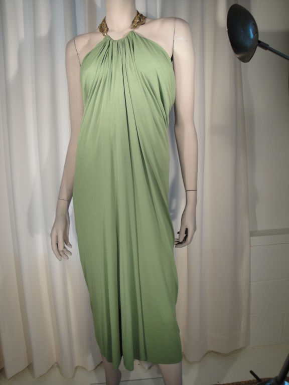 Green draped sleeveless dress with netting,bronze beading and diamante collar with hook and eye closure.