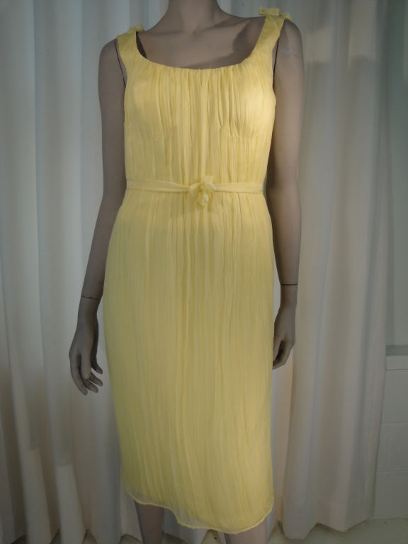 Fall 2005 Soft yellow pleated silk chiffon dress,zipper back with hook and eye closure, built in brasiere, fully lined in silk.