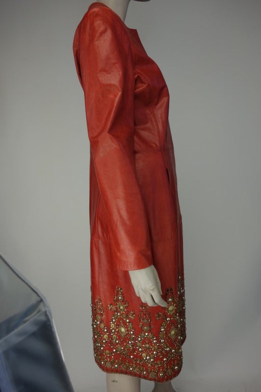 Oscar De la Renta red leather zip front coat with exclusive embroidery, two front pockets and fully lined in silk.