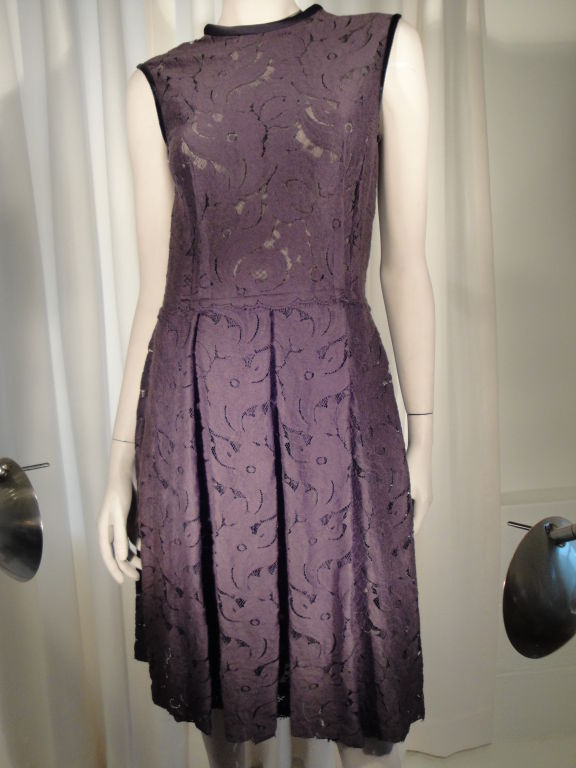 Fall 2006 sleeveless raisin color lace dress with back zipper edged in black velvet and fully lined in silk. Size 38