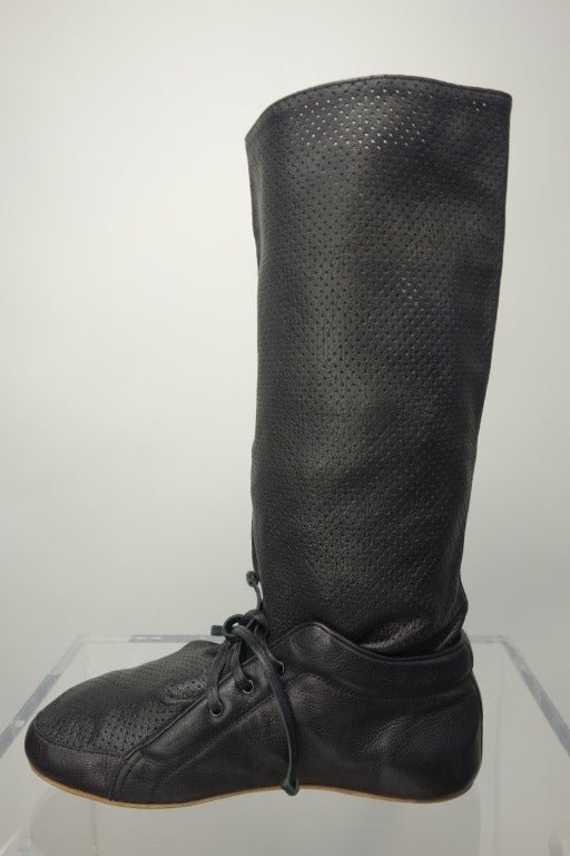 Balenciaga black perforated flat boot.