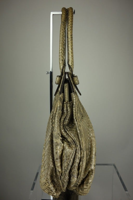 Zagliani gold metallic python shoulder bag with gold hardware, fully lined in suede, and one interior zip pocket.