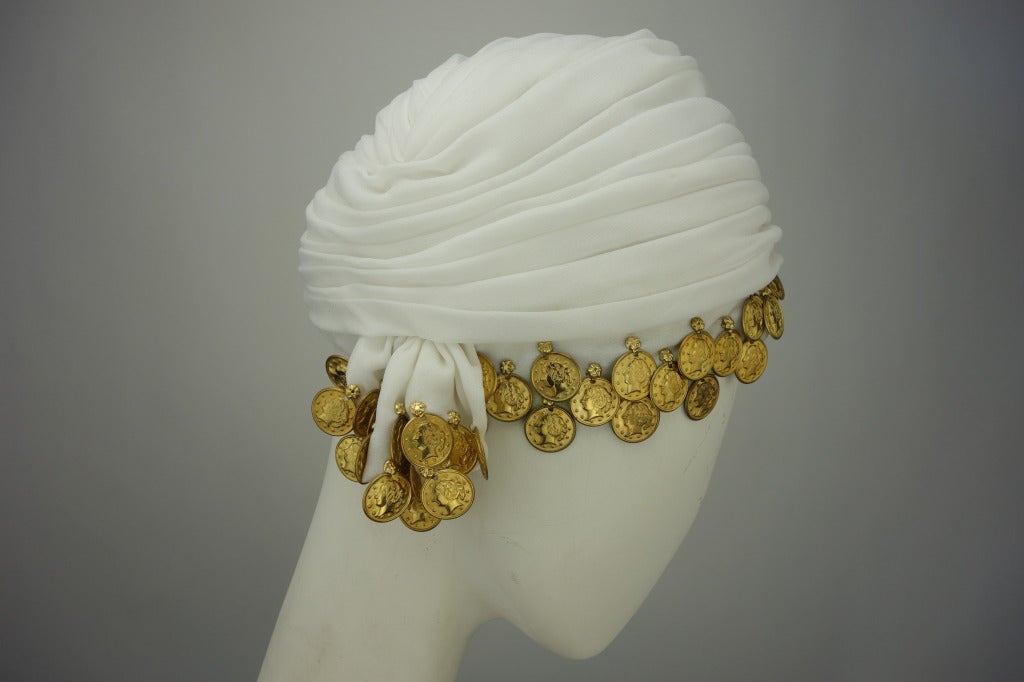 Christian Dior white turban with gold coin detail.

Circumference: 22.5