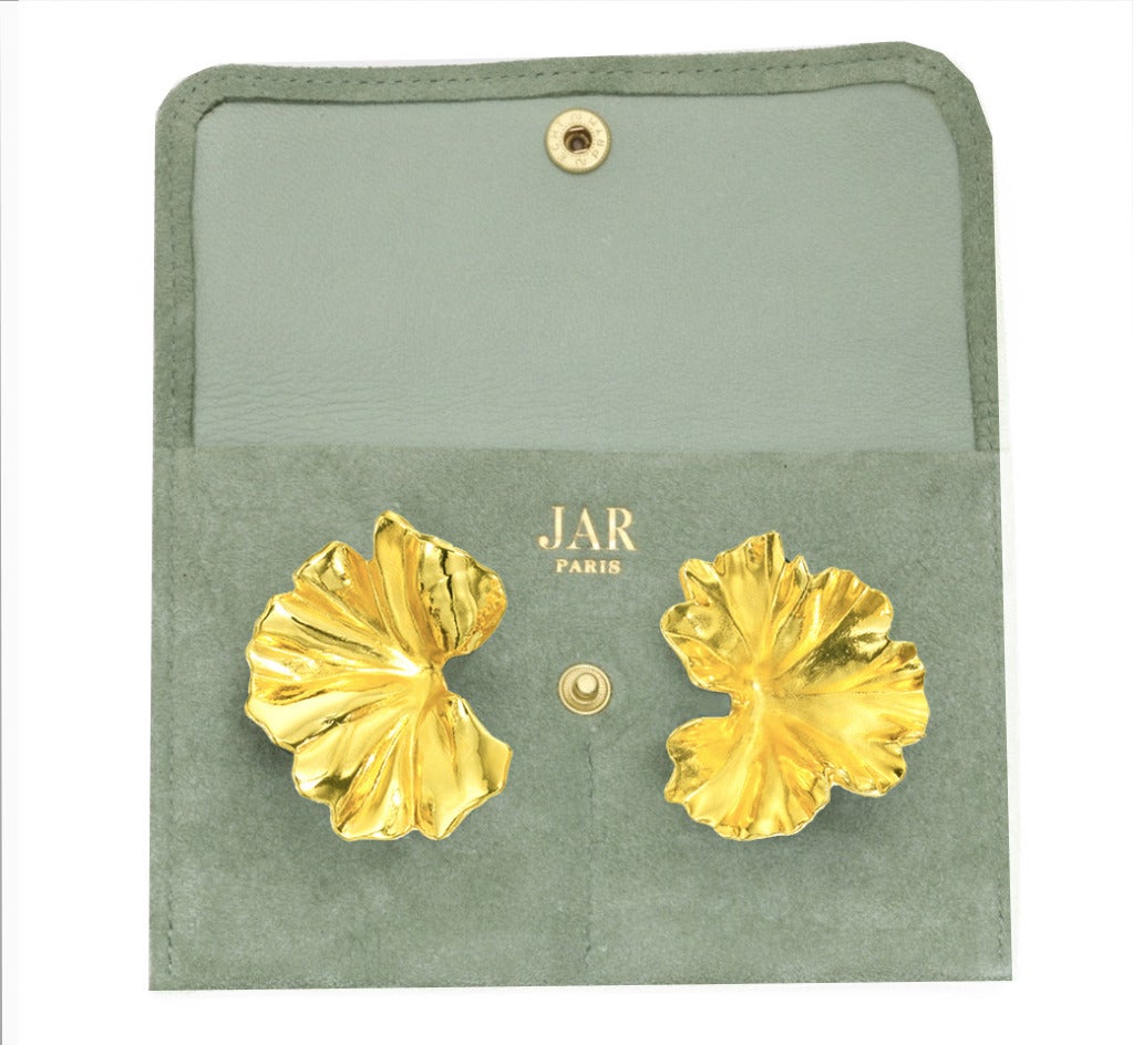 Exclusive piece of art by JAR (Joel Arthur Rosenthal). Each earring designed as a sculpted aluminum gold topped geranium leaf, mounted in 18k gold, with maker's marks Signed JAR.

The earrings come with the original suede pouch.

JAR is often
