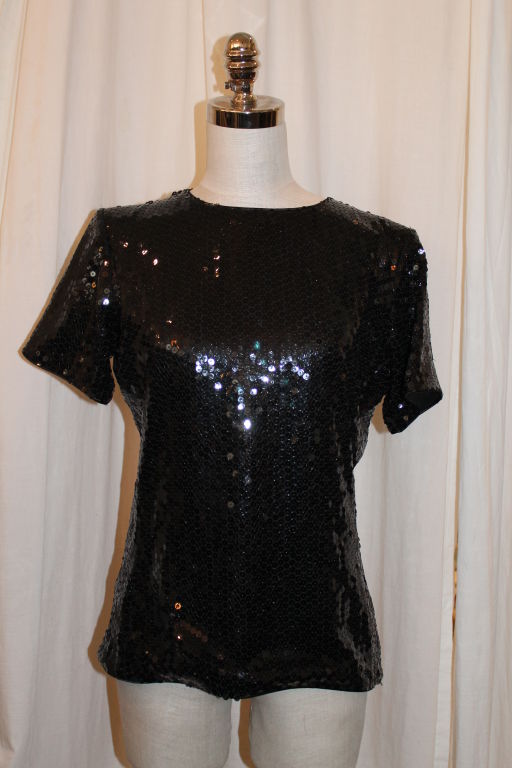 Vintage YSL Black Sequin Evening Top-Size 40. Short sleeve. Circa 90's. This garment is in very good pre-owned condition.<br />
<br />
Measurements:<br />
Bust: 34