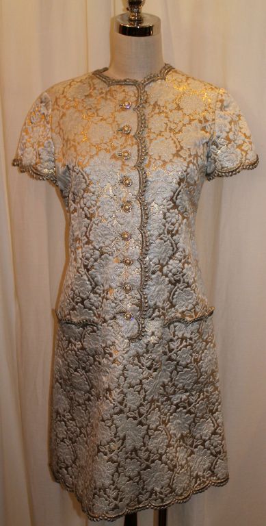 Vintage Oscar De La Renta Gold Silk Brocade Shift Dress. Circa Early 60's. Garment is in Good Pre-Owned Condition. Some staining to the inside lining of dress. No stains on the outside.