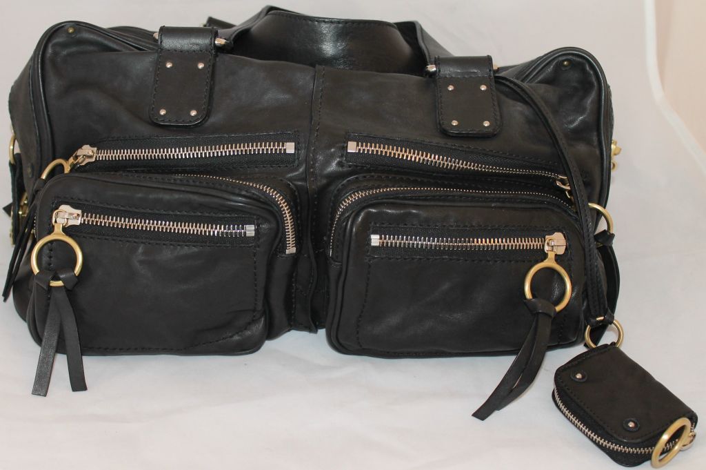 Chole large Paddington black leather handbag, silver and gold hardware. Multi pockets, has attached small coin purse that can be removed.