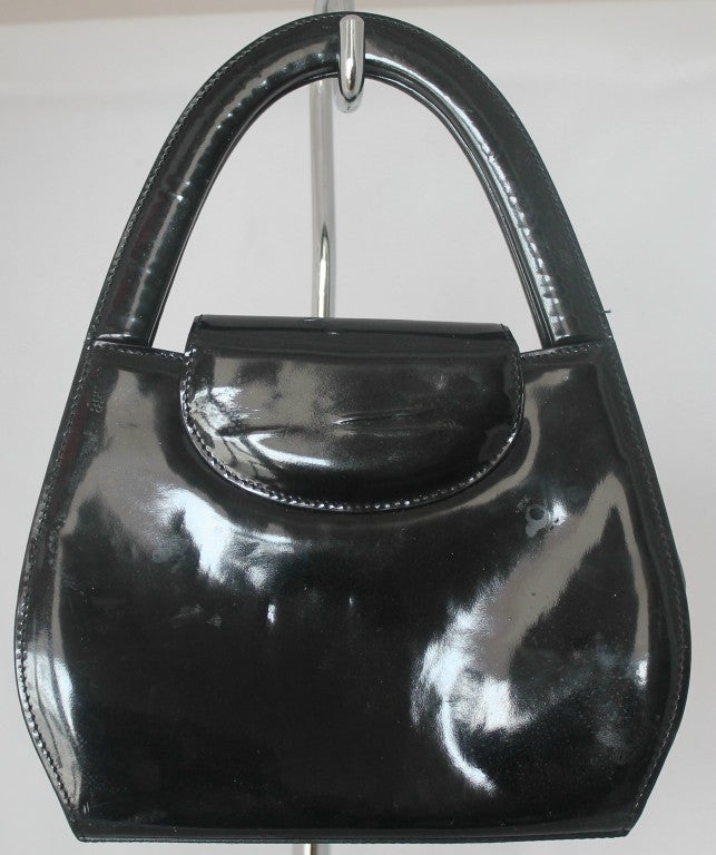 Cartier Panthere black patent leather handbag. GHW. One interior compartment and one exterior. Double handle, flap over with push lock closure. Hand drop is 4.5 inches.