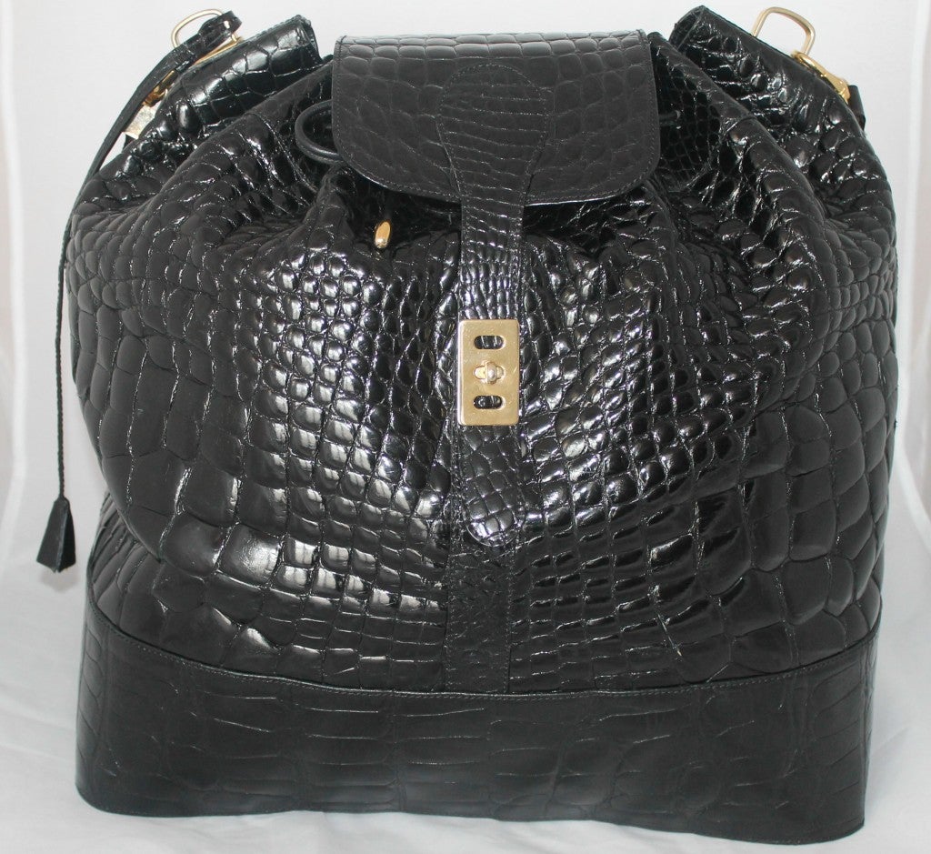 G. Borri black alligator x-large overnight bag. Two large interior zip compartments. Detachable shoulder strap and key set. Lock for sercurity. Detachable strap drop is 17.5 inches.