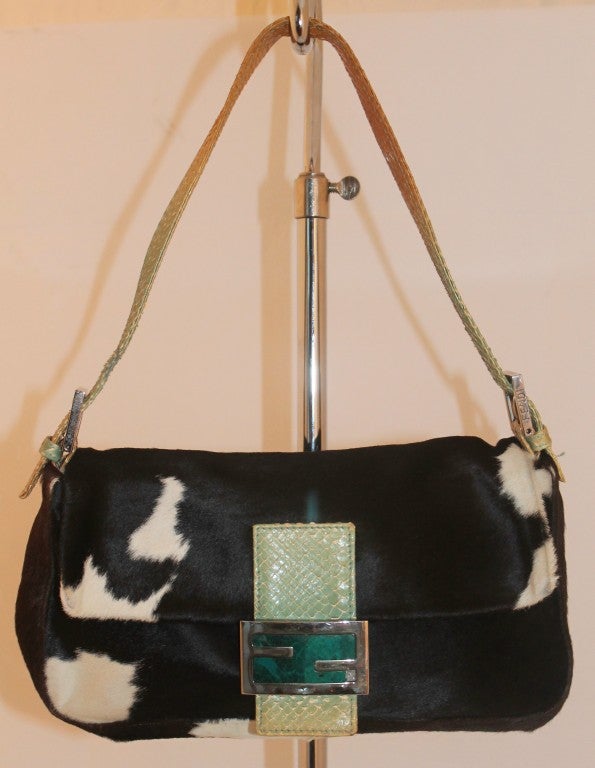 Fendi Black Pony Hair Bagutte Handbag. Teal snake handle and front closure. Flap closure. F detail is in jade, which has a chip (see pictures). One zip closure. Drop handle is 8