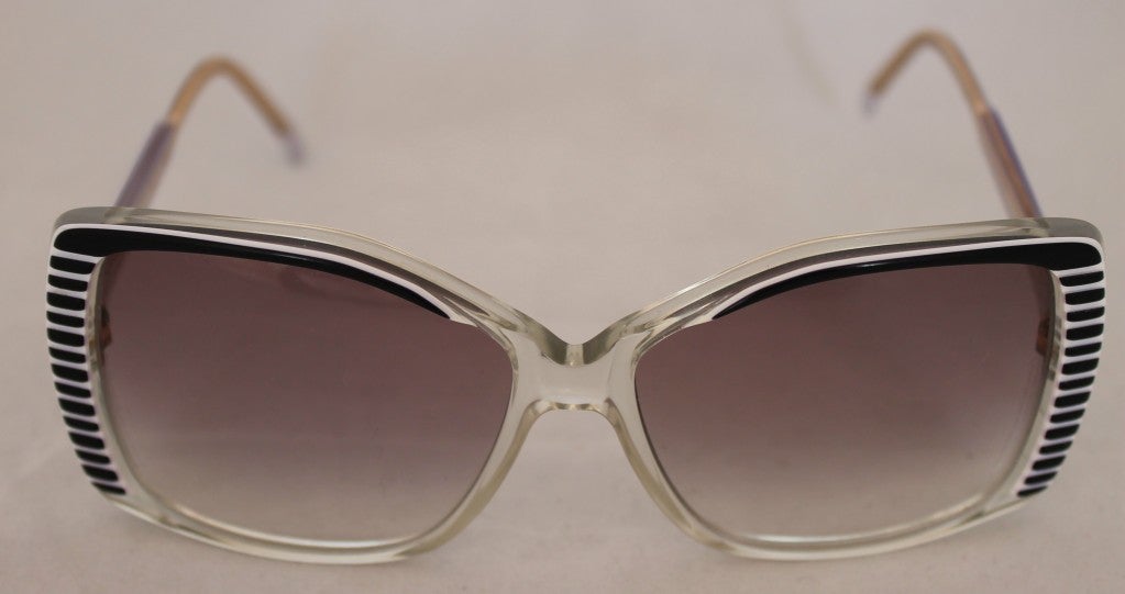 Rochas-Paris vintage black and white sunglasses. Highly collectable, stylish. New, never been worn with original tags. Length of arms is 5 inches. Sunglasses may be taken to eyeglass center for proper adjustment and fit.