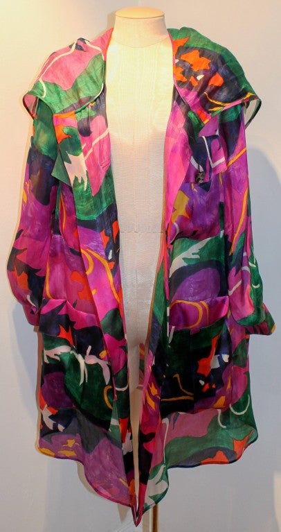 Valentino multi color silk organza jacket with hood. Shoulder to shoulder measurements are 18 inches. Sleeve length is 24 inches.