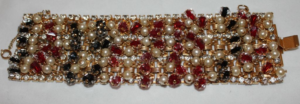 1960's Vintage Signed Hobe Goltone Wide Bracelet with Rhinestones and dangling pearls, red and black Crystals. 

Measurements: Length: 6 7/8