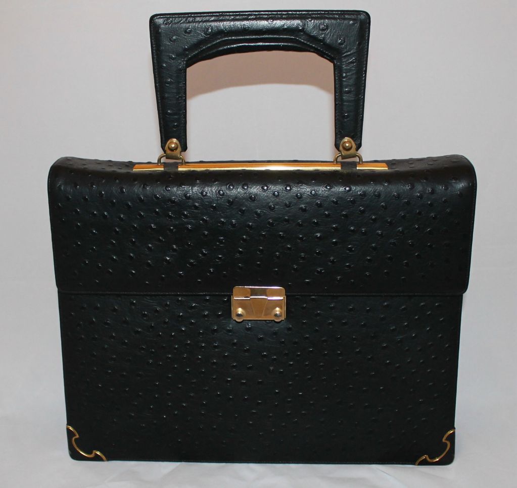 Vintage Black Ostrich Top handle Large Handbag with Detachable Gold Chain Strap and red leather interior.
