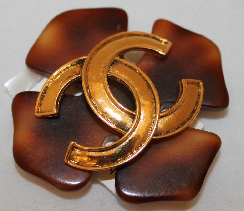 Chanel tortoise shell brooch with gold CC's