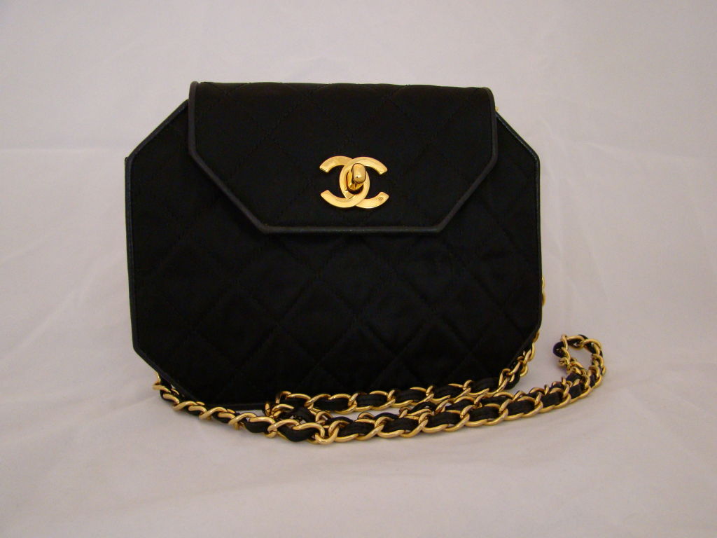 Vintage Chanel Hexagonal Black Satin Bag with Red Leather Lining. Comes with Authenticity Card and Duster. In Excellent Condition.