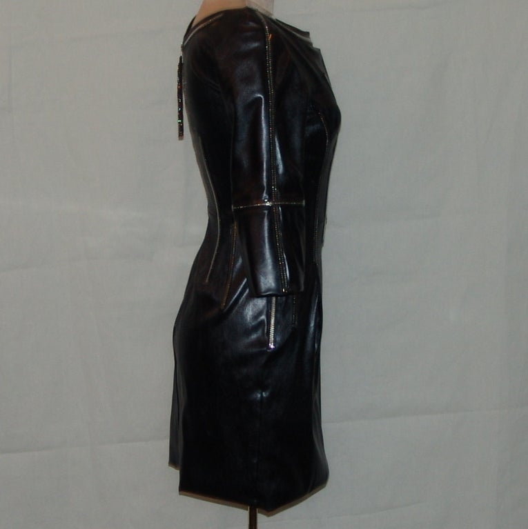 Dolce & Gabbana black leather dress with rhinestone detail. Size 42. This item is in excellent condition.
Measurements are as follows:
length 30