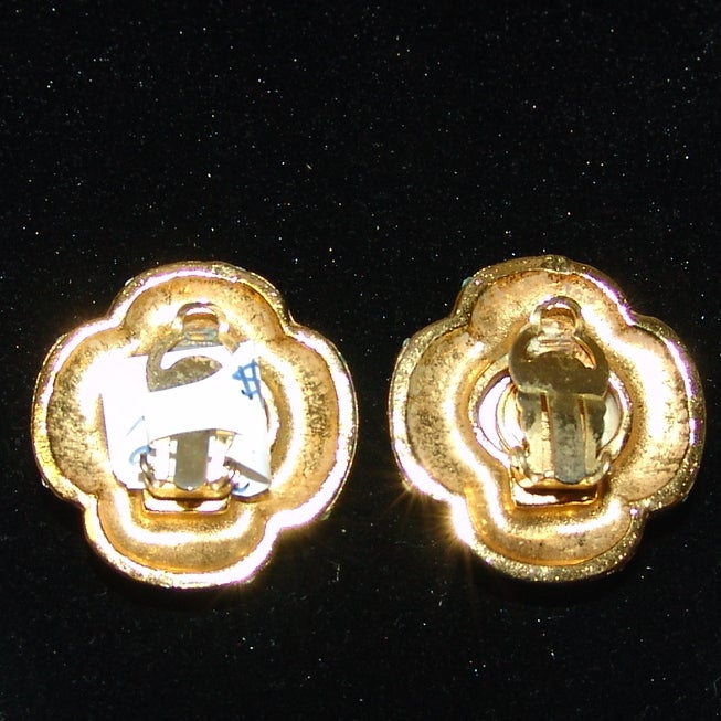 Chanel gold clip on earrings with pearl center and rhinestones around.  About 1.25